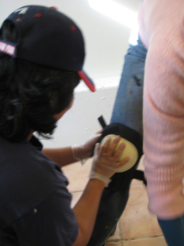 Julie, getting fitted for knee-pads 